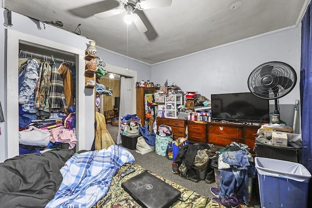 bedroom featuring a ceiling fan, carpet floors, and ornamental molding