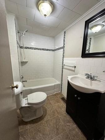 91 W Main St, West Brookfield, MA 01585 - full bath with tile patterned floors, bathing tub / shower combination, toilet, tile walls, and vanity