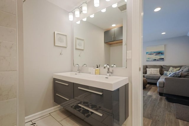 5 Birch Hill Rd, Dennis, MA 02639 - ensuite bathroom featuring double vanity, baseboards, and recessed lighting