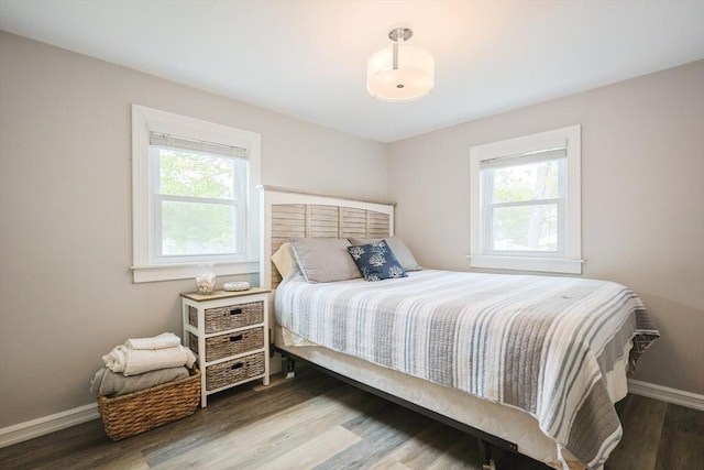 5 Birch Hill Rd, Dennis, MA 02639 - bedroom with multiple windows, wood finished floors, and baseboards