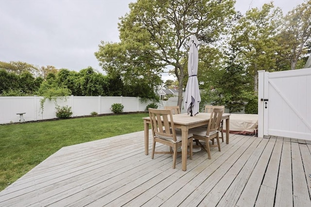 5 Birch Hill Rd, Dennis, MA 02639 - wooden deck with outdoor dining area and a gate