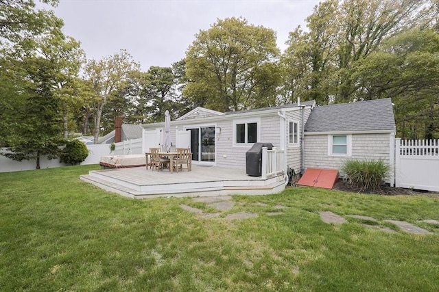 5 Birch Hill Rd, Dennis, MA 02639 - back of property featuring a wooden deck, outdoor dining space, and view of wooded area