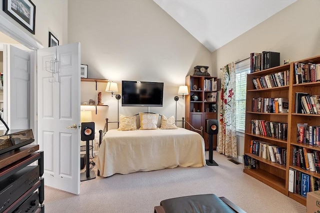 bedroom featuring carpet floors and lofted ceiling