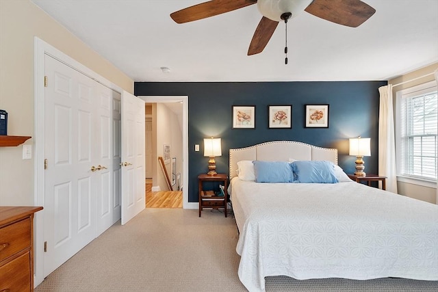 carpeted bedroom featuring a ceiling fan