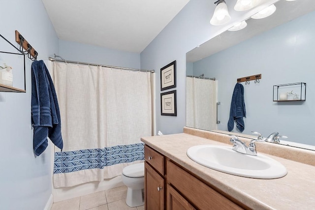 bathroom featuring tile patterned floors, toilet, vanity, and shower / tub combo