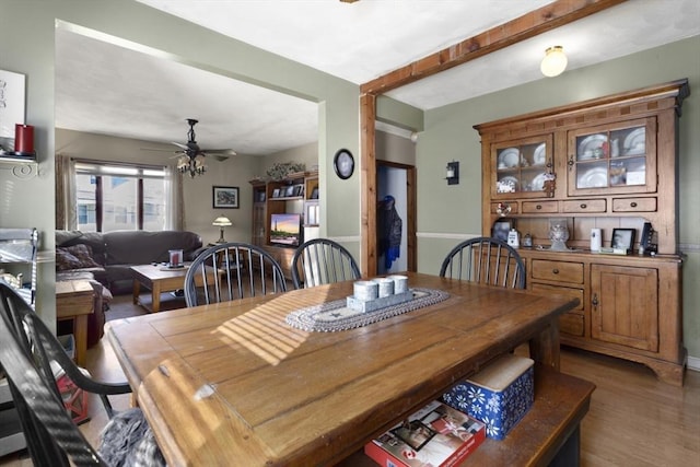 dining area with hardwood / wood-style flooring and ceiling fan