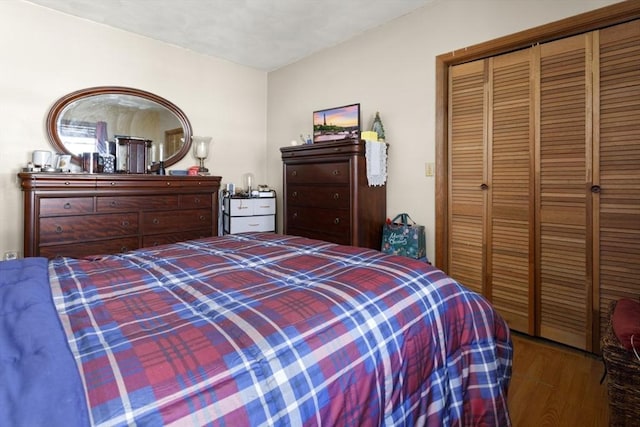 bedroom featuring hardwood / wood-style flooring and a closet