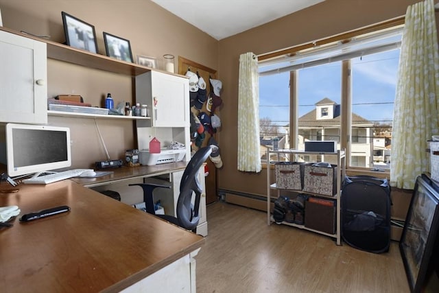 office area featuring light hardwood / wood-style flooring and baseboard heating