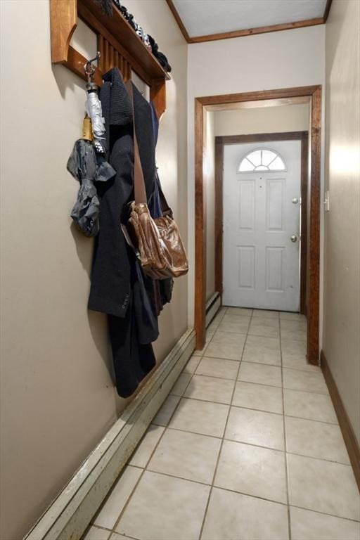 doorway to outside featuring crown molding and a baseboard heating unit