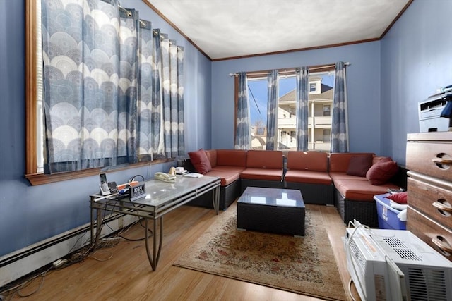 living room with hardwood / wood-style floors and ornamental molding