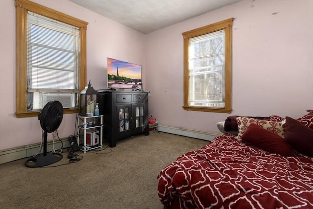 bedroom with cooling unit, a baseboard heating unit, and carpet