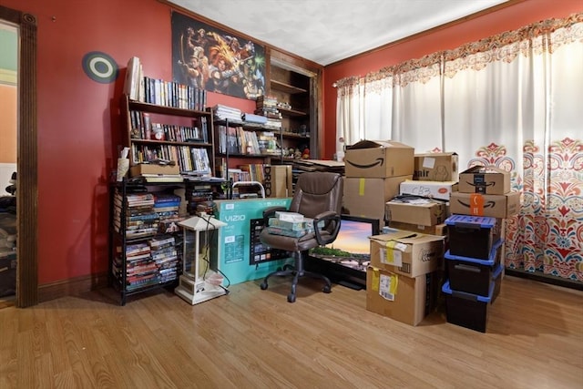 interior space featuring built in shelves and light hardwood / wood-style flooring