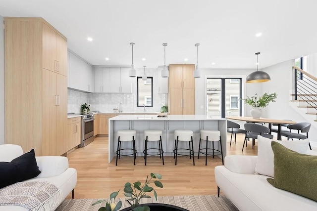 354 Linwood Ave Unit 354, Newton, MA 02460 - living area featuring light wood finished floors, stairs, and recessed lighting