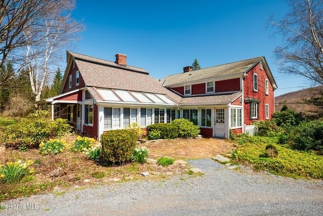 view of front of property featuring a sunroom