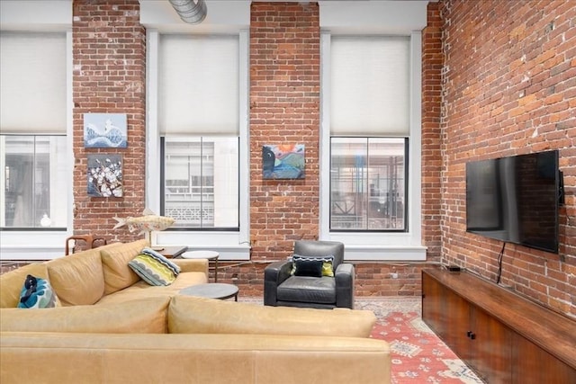 living room with brick wall