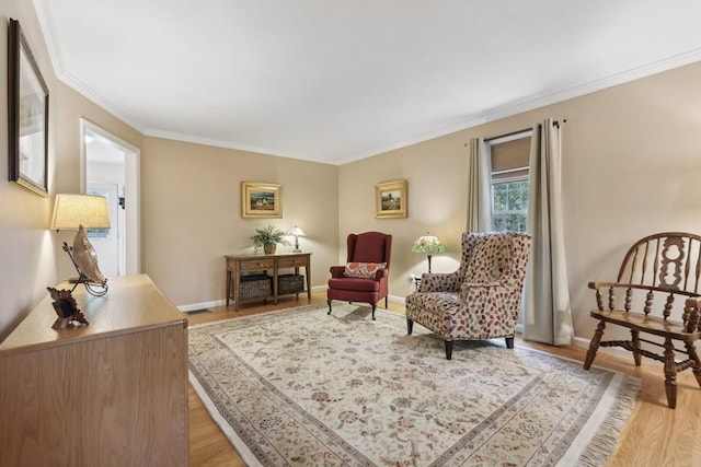 176 Crescent St, Stow, MA 01775 - living area featuring light wood-type flooring, ornamental molding, and baseboards