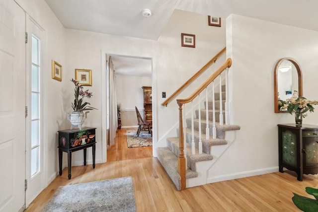 176 Crescent St, Stow, MA 01775 - entryway featuring wood finished floors, stairway, and healthy amount of natural light