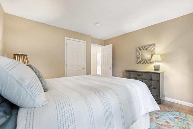 176 Crescent St, Stow, MA 01775 - bedroom with baseboards and light wood-style flooring