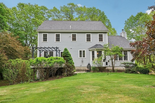 176 Crescent St, Stow, MA 01775 - back of property featuring a pergola, a lawn, a chimney, and roof with shingles