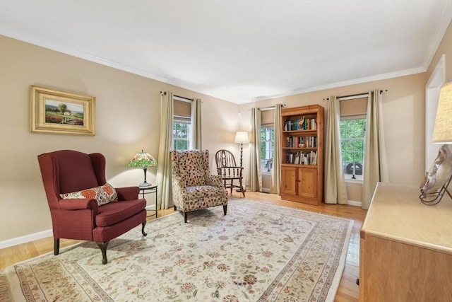 176 Crescent St, Stow, MA 01775 - living area featuring wood finished floors, ornamental molding, and baseboards