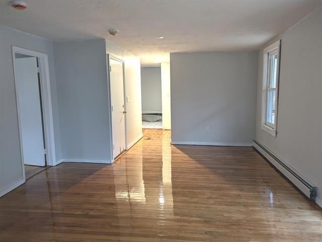 3 S Shore Rd, Salem, NH 03079 - unfurnished room featuring a baseboard radiator and wood finished floors