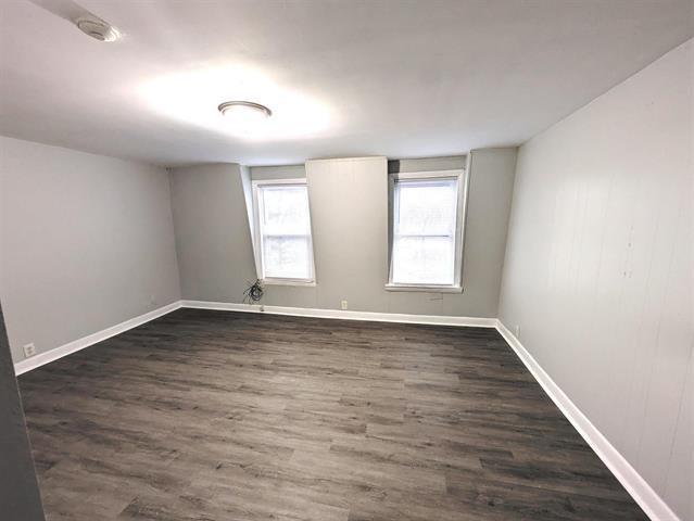 3 S Shore Rd, Salem, NH 03079 - empty room featuring dark wood-style flooring and a smoke detector