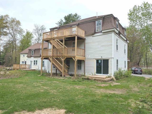 3 S Shore Rd, Salem, NH 03079 - back of house featuring stairs, a deck, a yard, mansard roof, and roof with shingles