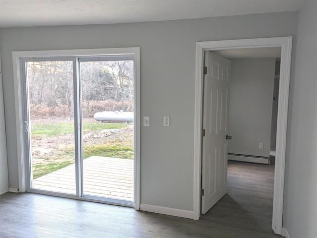 3 S Shore Rd, Salem, NH 03079 - doorway to outside with baseboard heating and wood finished floors