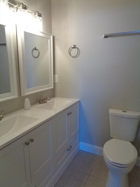 12 Brookside Rd Unit 20, Westford, MA 01886 - bathroom featuring toilet, tile patterned flooring, baseboards, and double vanity