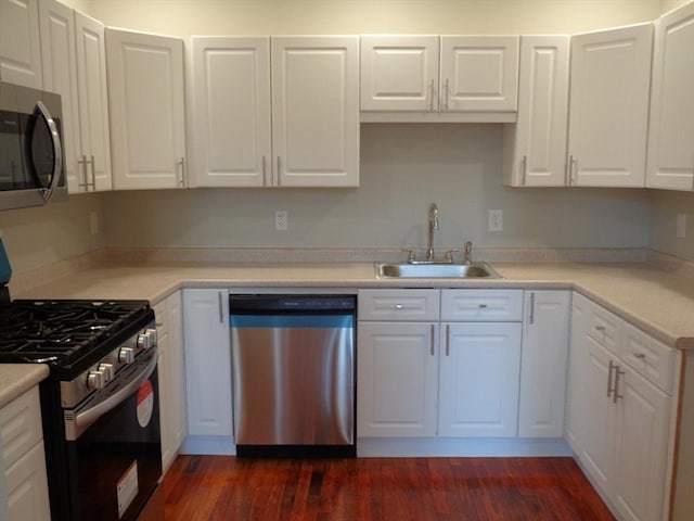 12 Brookside Rd Unit 20, Westford, MA 01886 - kitchen with stainless steel appliances, a sink, white cabinets, and light countertops