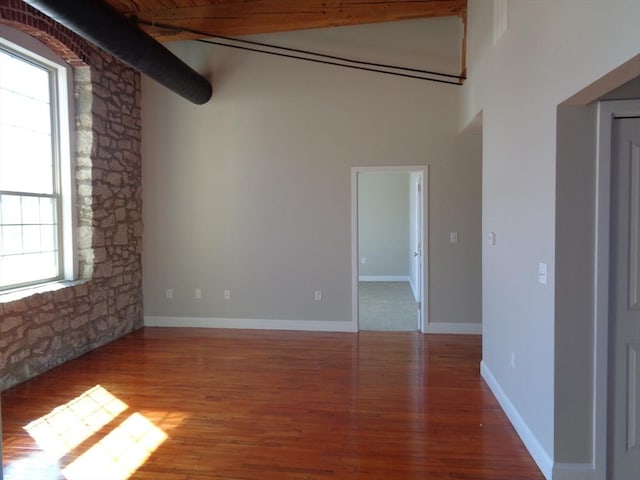 12 Brookside Rd Unit 20, Westford, MA 01886 - unfurnished room featuring wood finished floors, a towering ceiling, and baseboards