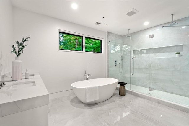 bathroom featuring vanity and separate shower and tub