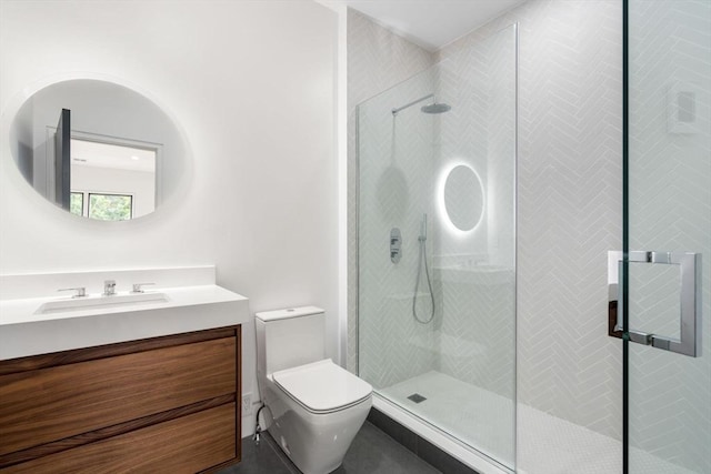 bathroom featuring vanity, toilet, and an enclosed shower