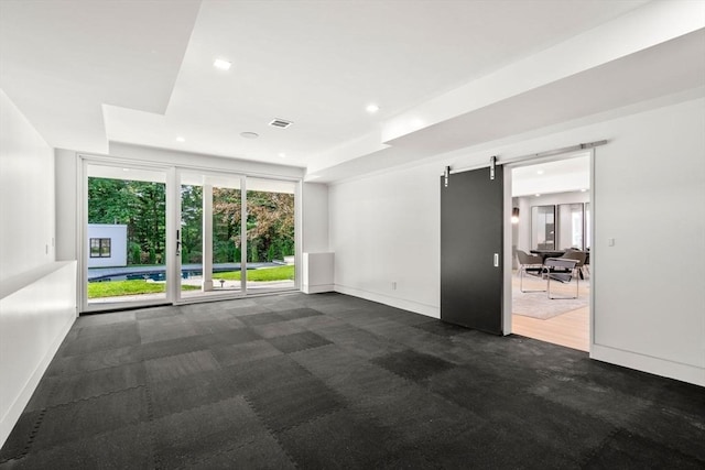 empty room featuring a barn door