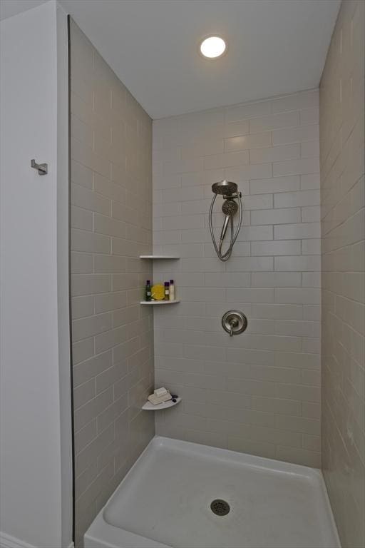 bathroom with tiled shower