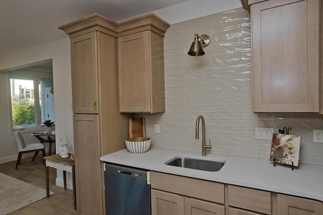 kitchen featuring sink, light brown cabinets, dishwasher, light hardwood / wood-style floors, and backsplash