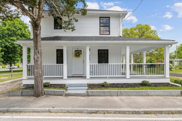 1009 Point Rd, Marion, MA 02738 - farmhouse-style home featuring a porch and roof with shingles