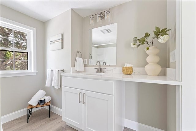 1009 Point Rd, Marion, MA 02738 - full bath featuring vanity, wood finished floors, baseboards, and a shower