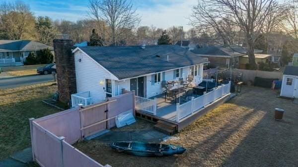 rear view of property with a deck