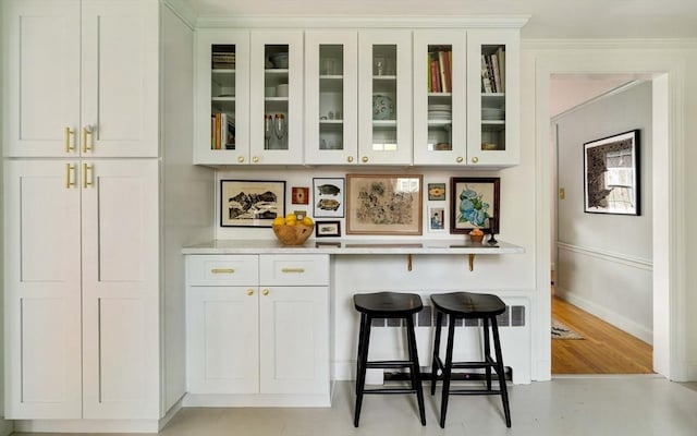 bar with baseboards and light wood-type flooring