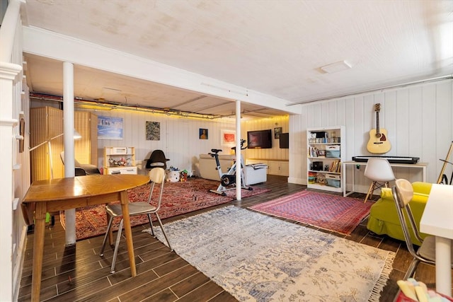 interior space with wooden walls and wood finished floors