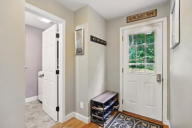 21 Rose Ln, Uxbridge, MA 01569 - doorway featuring baseboards and washer / clothes dryer