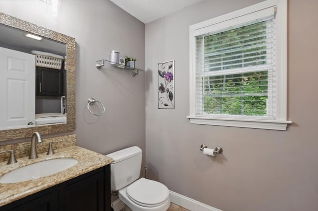 21 Rose Ln, Uxbridge, MA 01569 - half bathroom featuring toilet, vanity, and baseboards
