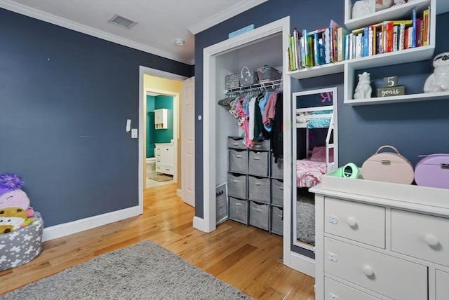 21 Rose Ln, Uxbridge, MA 01569 - bedroom featuring crown molding, light wood-style flooring, a closet, and baseboards