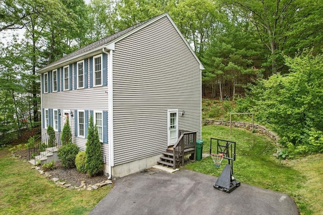 21 Rose Ln, Uxbridge, MA 01569 - view of side of home featuring a patio area and a lawn