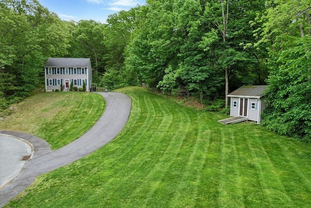 21 Rose Ln, Uxbridge, MA 01569 - view of grassy yard featuring a forest view
