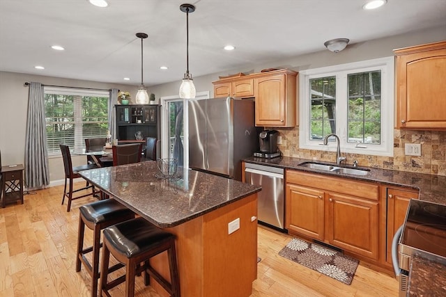 21 Rose Ln, Uxbridge, MA 01569 - kitchen with stainless steel appliances, a sink, light wood-style floors, tasteful backsplash, and recessed lighting