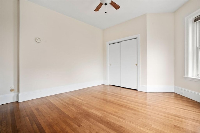 369 Tappan St Unit 8, Brookline, MA 02445 - unfurnished bedroom with light wood-type flooring, a closet, and ceiling fan