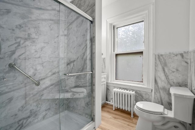 369 Tappan St Unit 8, Brookline, MA 02445 - full bathroom featuring radiator, a marble finish shower, and wood finished floors