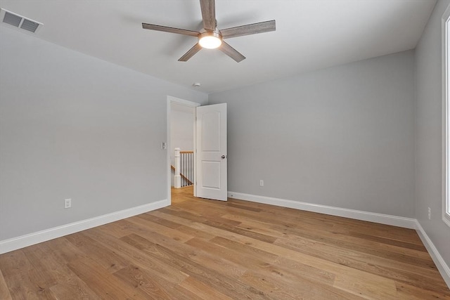 empty room featuring light hardwood / wood-style floors and ceiling fan